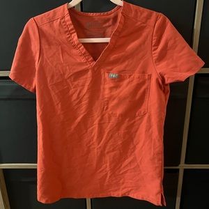 FIGS Light orange scrub top and jogger pants